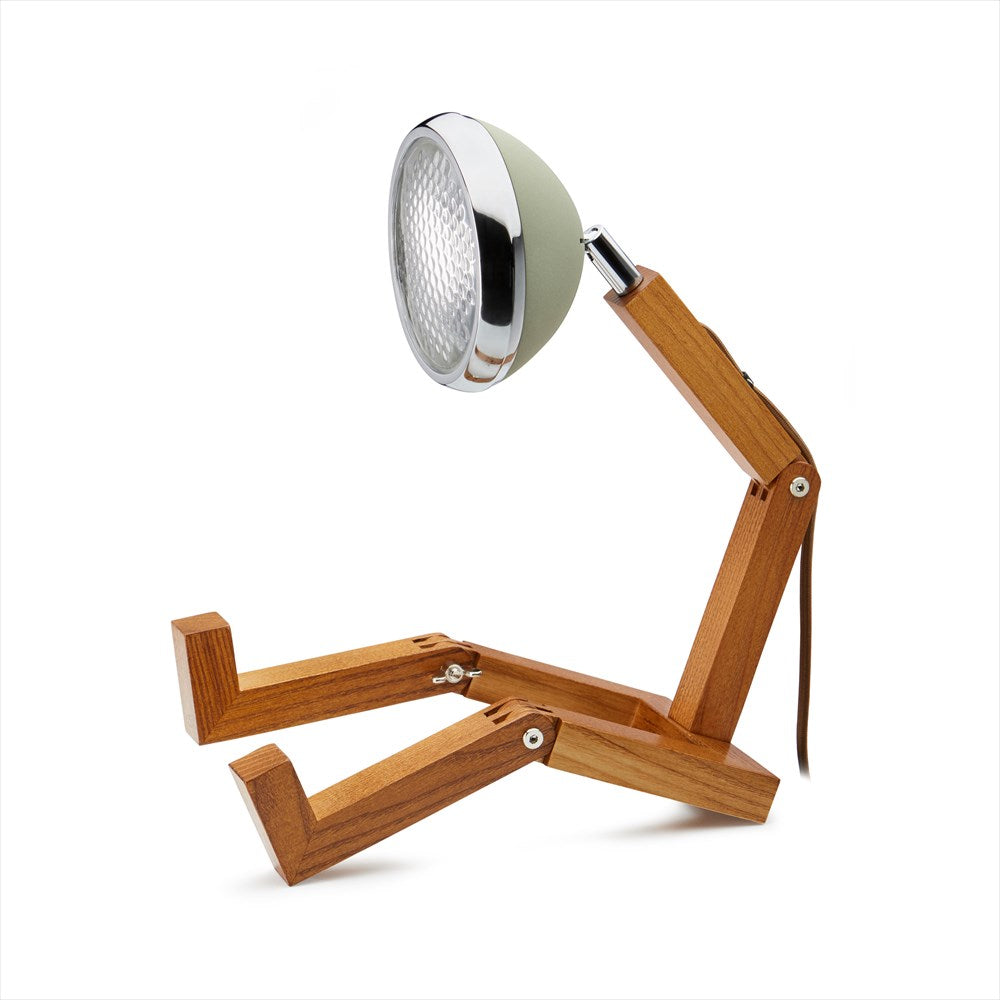 Skojig bordslampa i form av en figur med ben och en lampa som huvud. Färg: Desert Green.